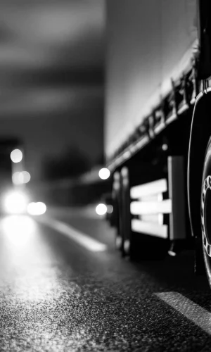 black-white-image-truck-driving-highway-night-truck-is-focus-68014-scaled-e1769702572847_11zon_11zon