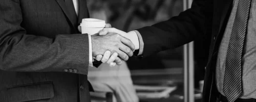 men-suits-shaking-hands_7_11zon_9_11zon