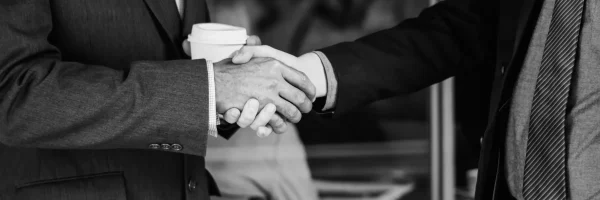 men-suits-shaking-hands_7_11zon_9_11zon