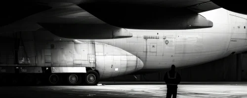 standing-tall-ground-crew-member-silhouetted-enormous-cargo-33621_2_11zon_10_11zon